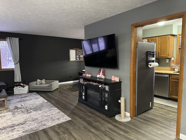 living room with dark hardwood / wood-style flooring and a textured ceiling