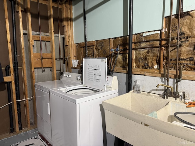 laundry area featuring sink and washer and clothes dryer