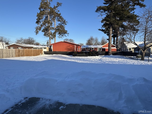 view of yard layered in snow