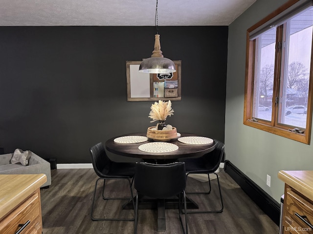 dining room with dark hardwood / wood-style floors