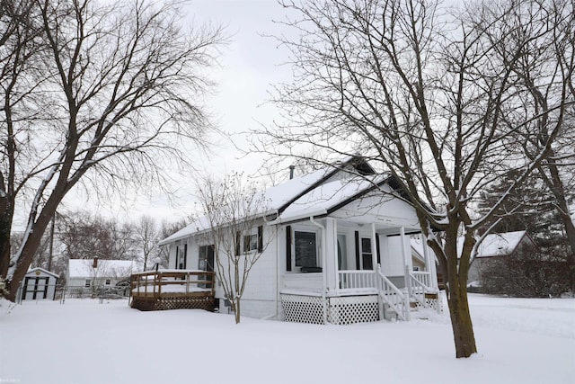 view of front of property with a storage shed