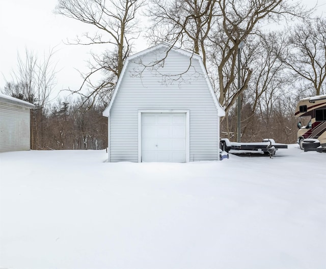 view of snow covered garage