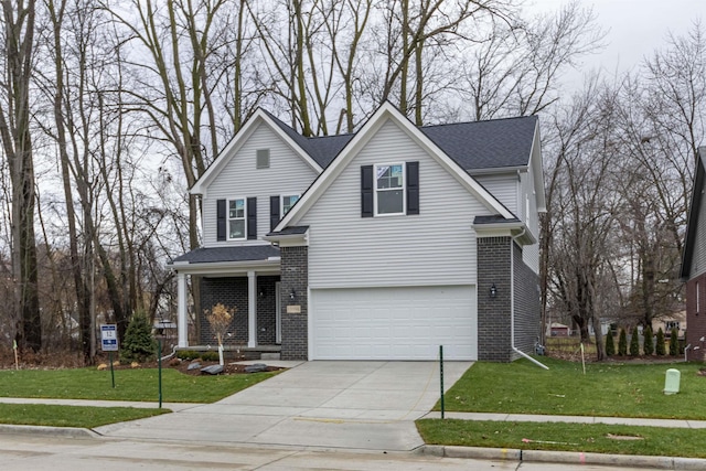 view of property with a garage and a front lawn