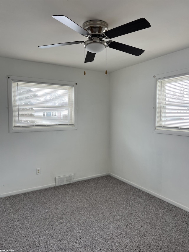 empty room with carpet flooring