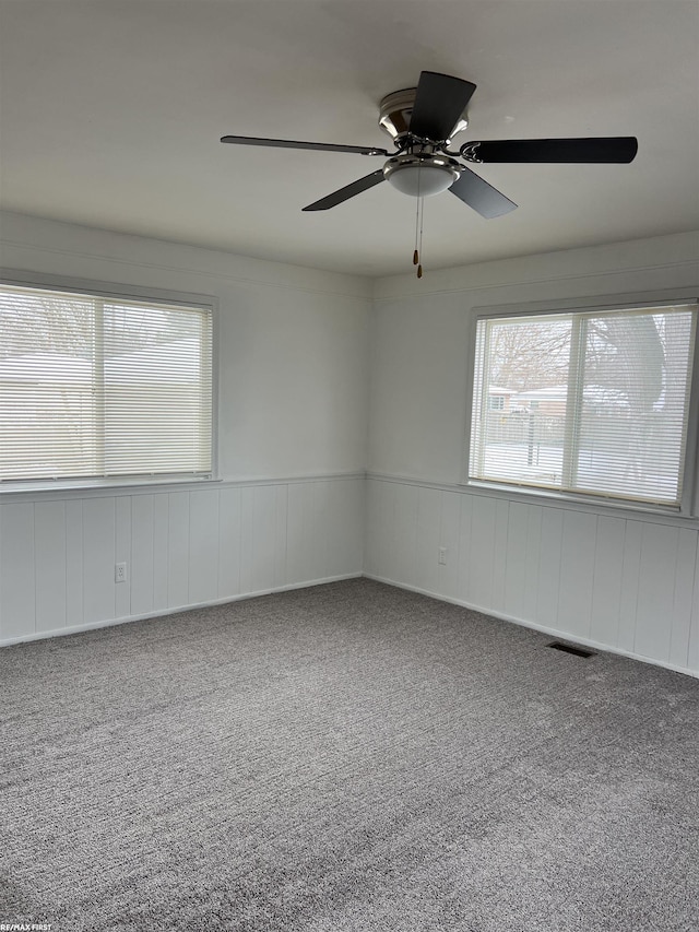 unfurnished room featuring carpet