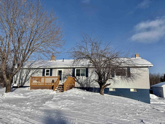 view of front of property with a wooden deck