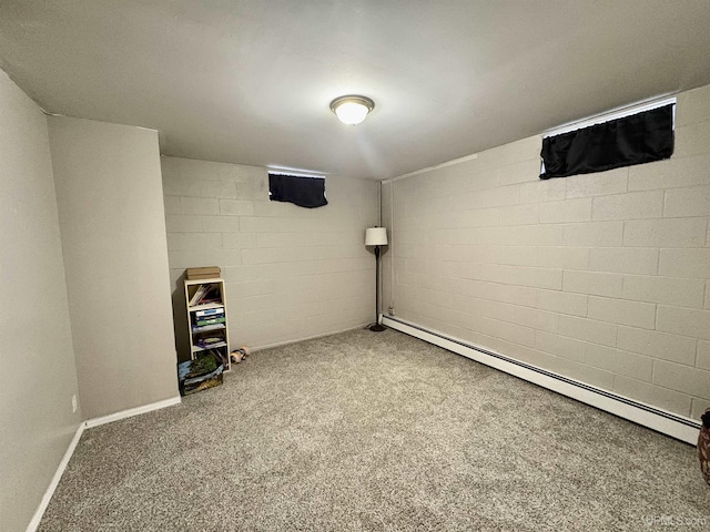 basement featuring a baseboard radiator and carpet floors