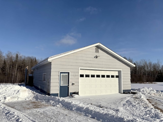 view of snow covered garage