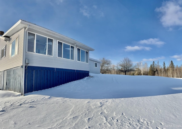 view of snow covered property