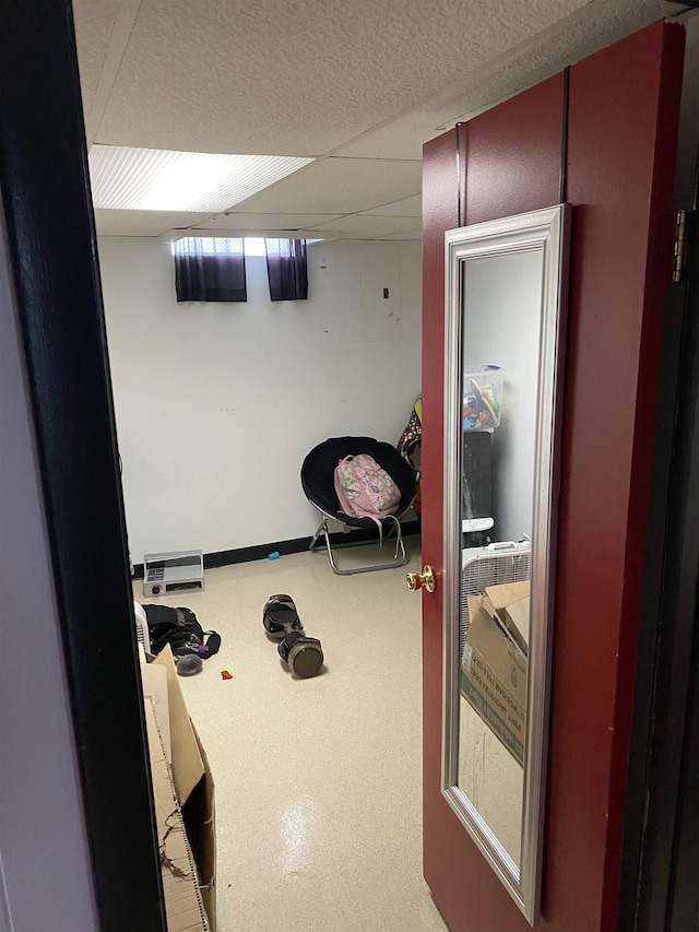 workout area with a paneled ceiling