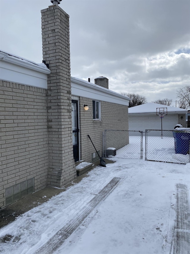 snow covered property featuring cooling unit