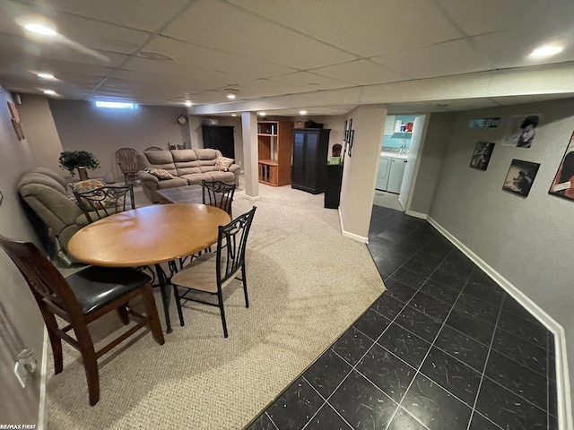 dining room featuring washing machine and dryer and a paneled ceiling