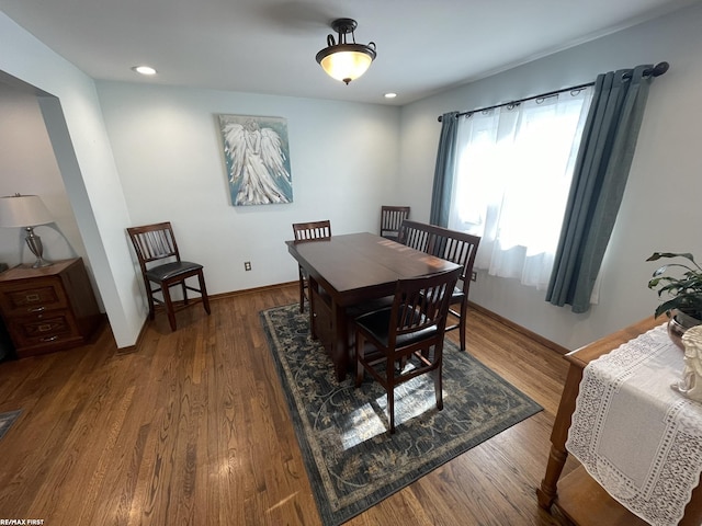 dining area featuring dark hardwood / wood-style flooring