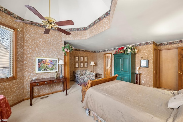 bedroom featuring light colored carpet and ceiling fan