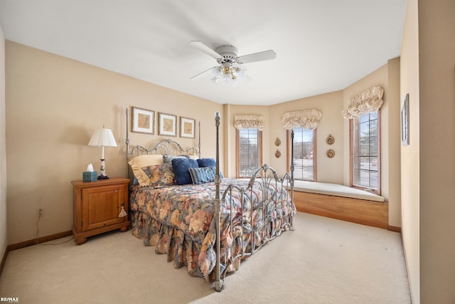 bedroom with ceiling fan and carpet floors