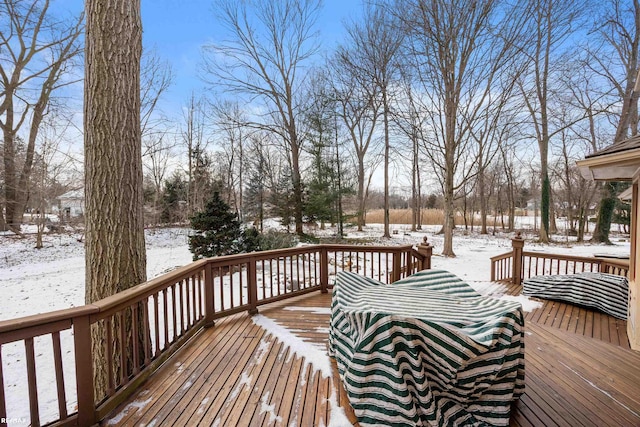 view of snow covered deck