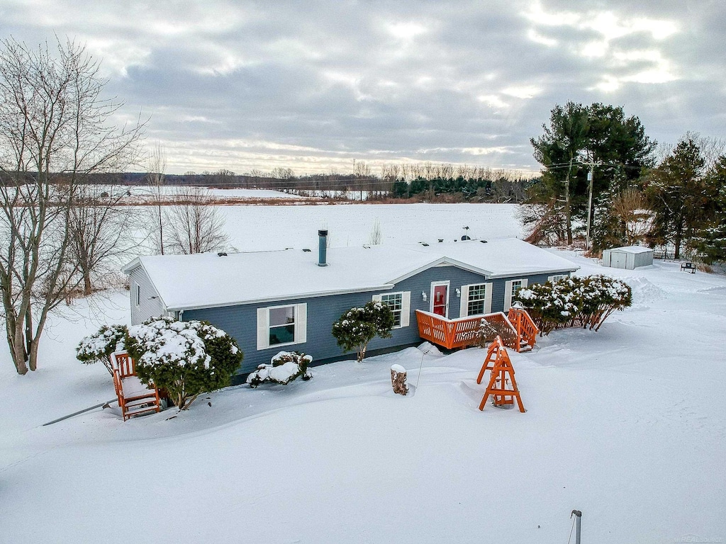 view of front of house featuring a wooden deck