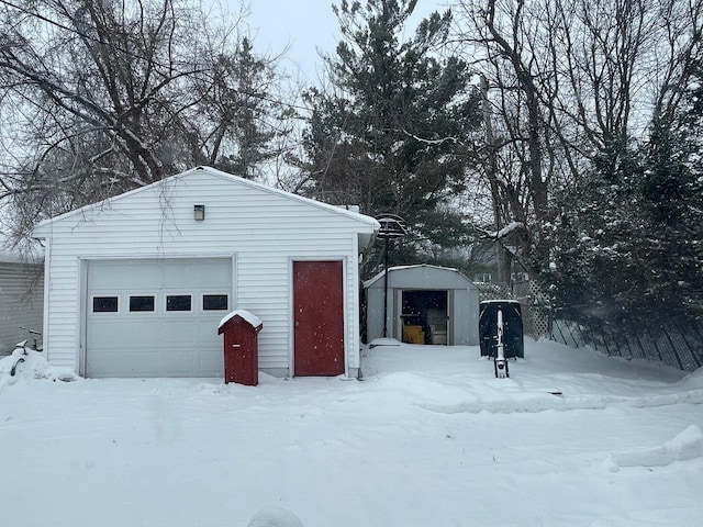 view of snow covered garage