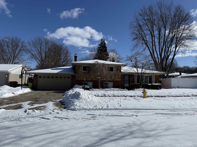 split level home with a garage