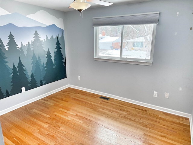 unfurnished room with hardwood / wood-style floors