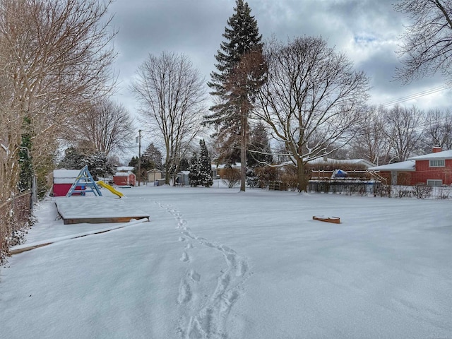 view of yard layered in snow