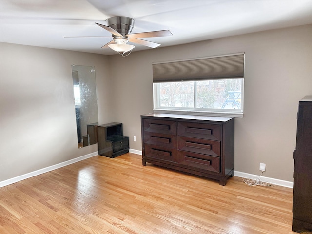 interior space with ceiling fan and light hardwood / wood-style flooring