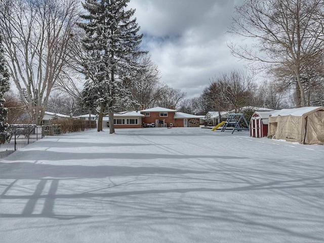 view of yard covered in snow