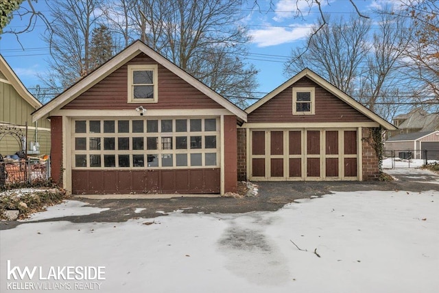 view of snow covered garage