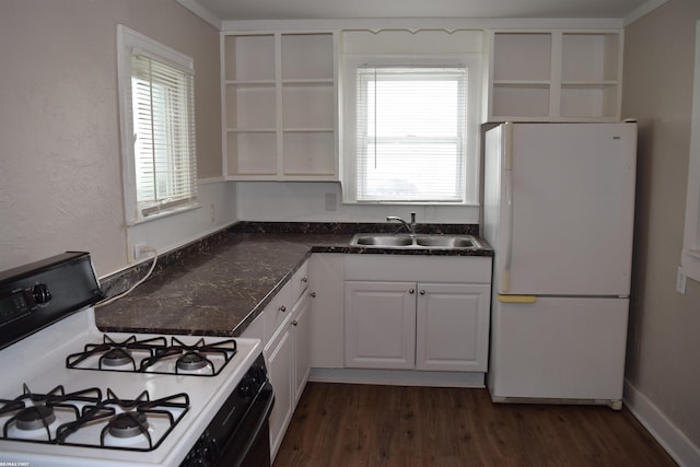 kitchen featuring white cabinets, gas stove, white refrigerator, dark hardwood / wood-style flooring, and sink