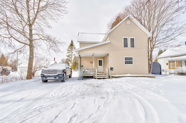 view of property featuring covered porch