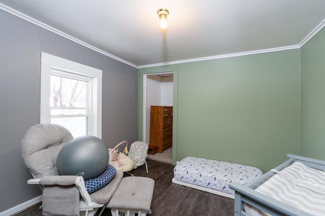 bedroom featuring crown molding and dark hardwood / wood-style flooring