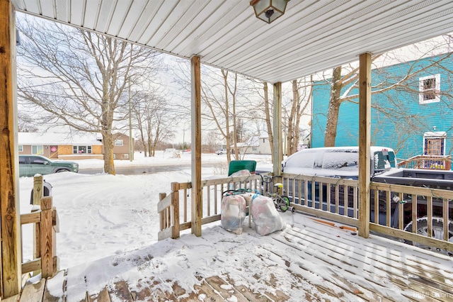 view of snow covered deck