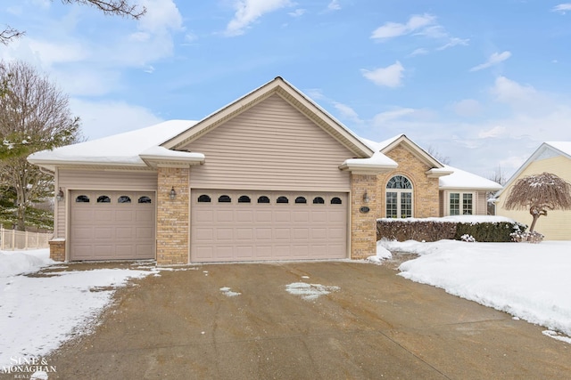 ranch-style home featuring a garage