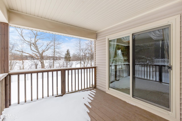 view of snow covered deck