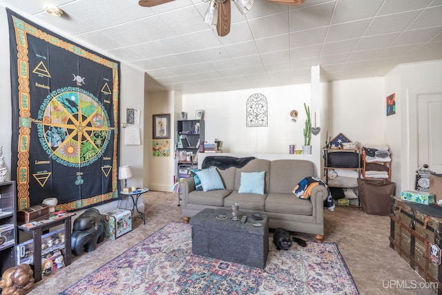 carpeted living room with ceiling fan