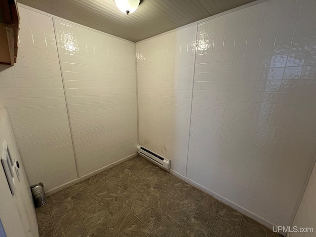 clothes washing area featuring a baseboard radiator