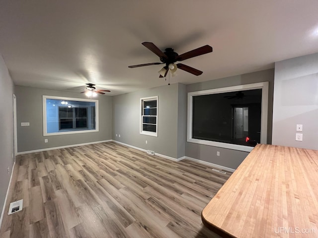 unfurnished living room with hardwood / wood-style floors