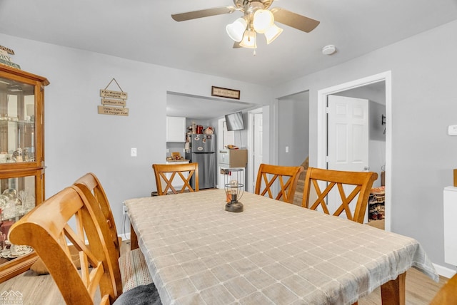 dining room featuring light hardwood / wood-style flooring and ceiling fan