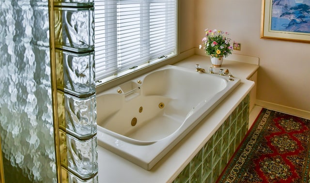 bathroom with tiled bath