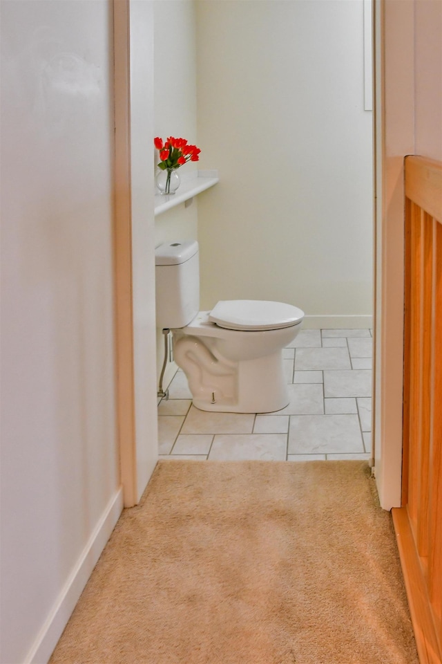 bathroom with tile patterned flooring and toilet