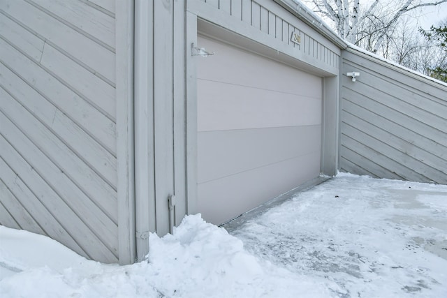 view of snow covered garage