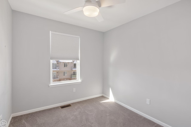 carpeted empty room with ceiling fan