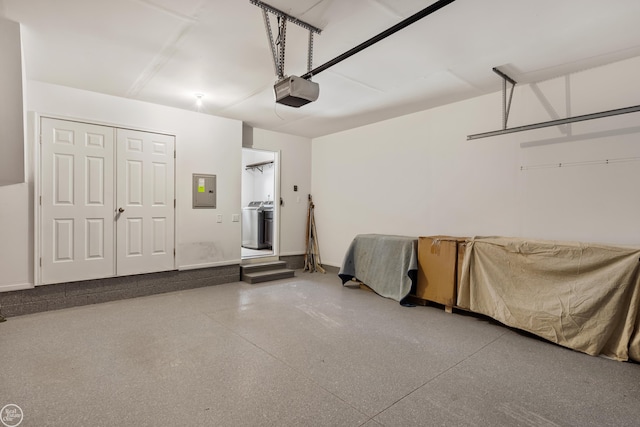 garage featuring electric panel and a garage door opener