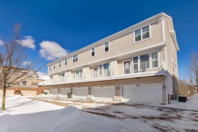 multi unit property featuring central AC and a garage