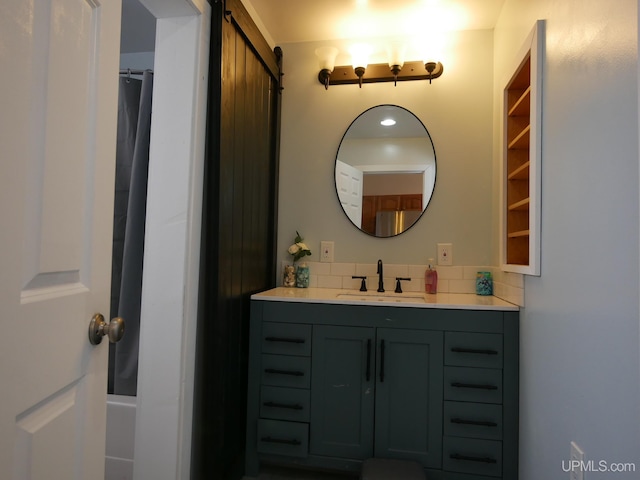 bathroom with vanity and curtained shower