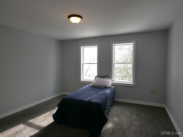 bedroom with dark carpet