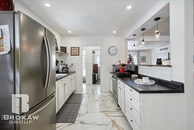 kitchen with white cabinets, dark countertops, marble finish floor, stainless steel appliances, and open shelves