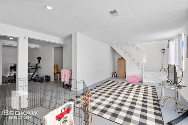 interior space with recessed lighting, visible vents, and stairs