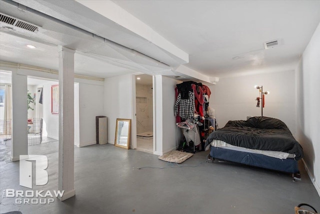 bedroom featuring visible vents and concrete flooring