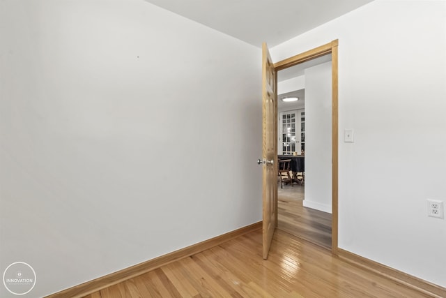 unfurnished room featuring hardwood / wood-style flooring